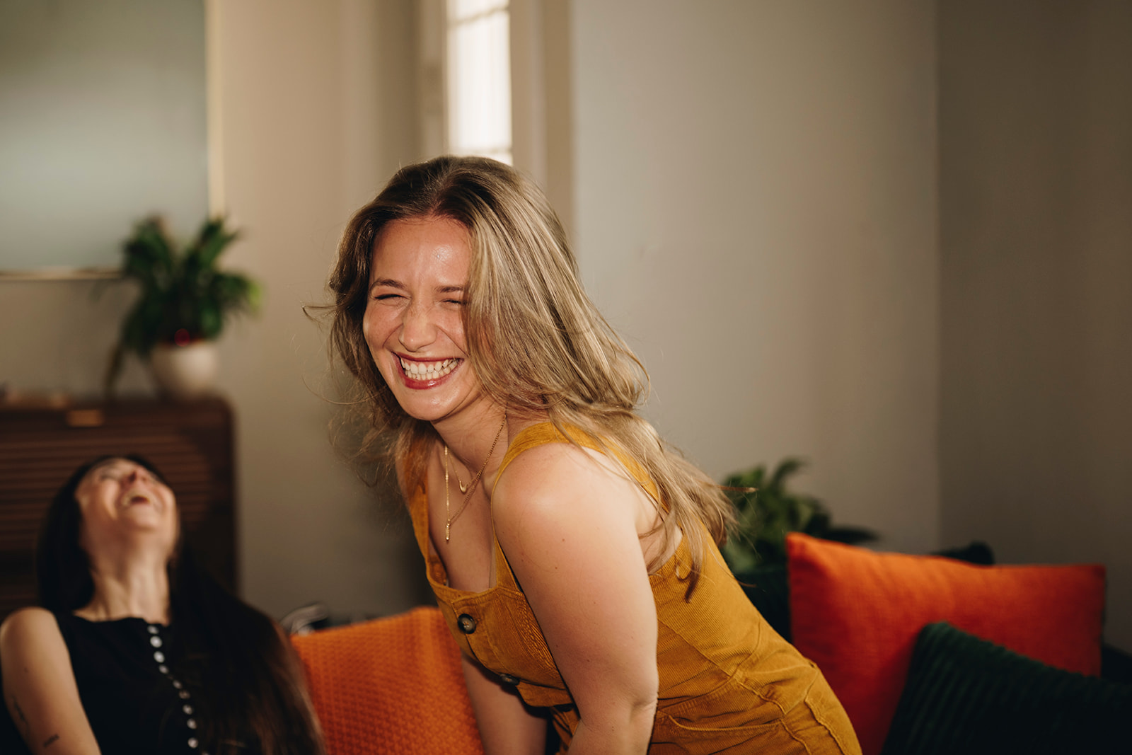 Alaina laughing with a friend